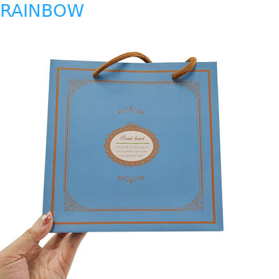 White Kraft Paper Shopping Clothing Cosmetic Perfume Gift Bag Luxury Handle Custom Logo Printed Paper Bag untuk Pakaian